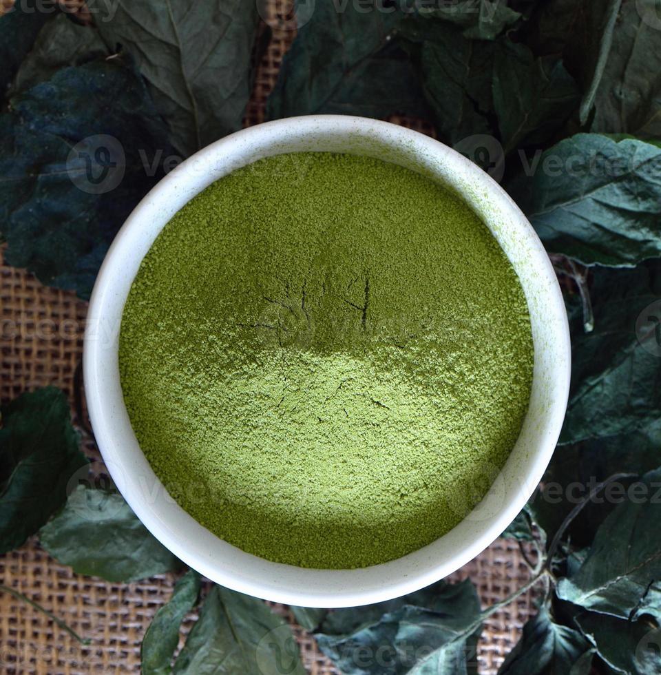 Green tea powder in cup photo