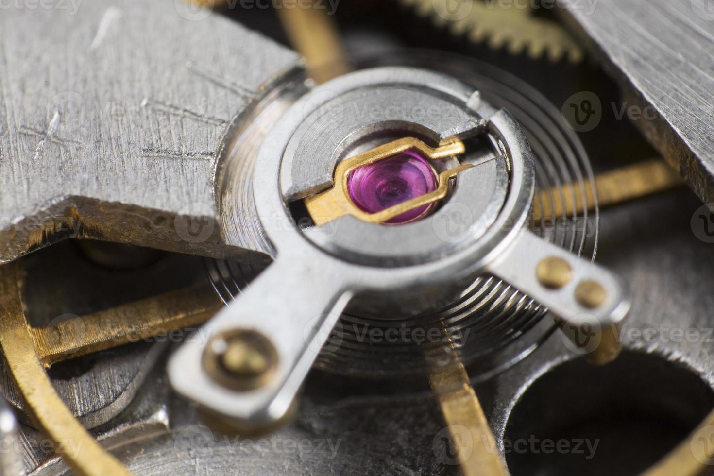 Macro detail of the ruby in the mechanism of a wristwatch photo