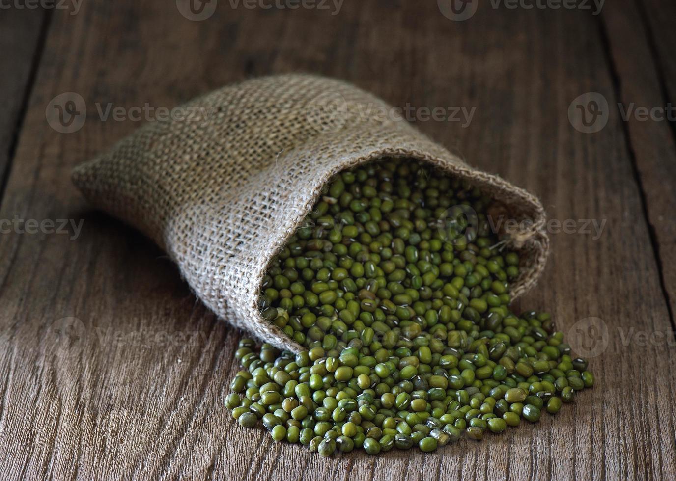 green gram or mung bean in sacks on table photo