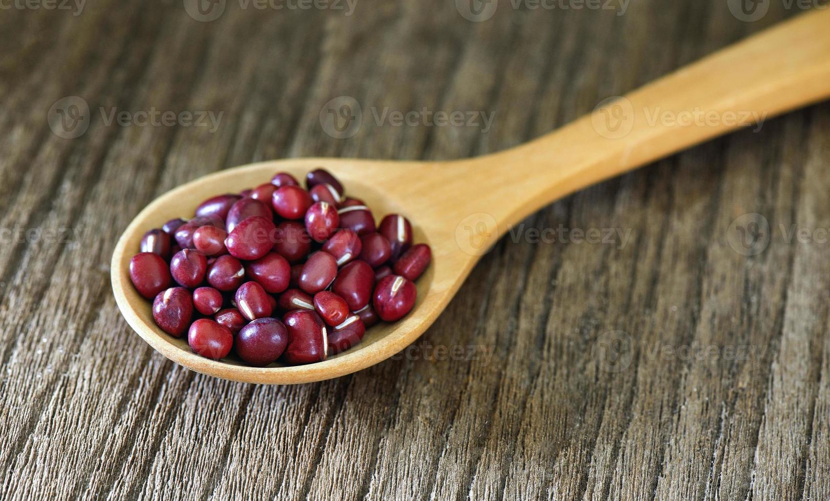 azuki  in wood spoon on table photo