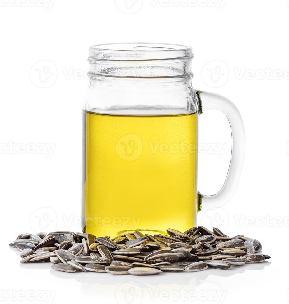 sunflower seed oil on white background photo