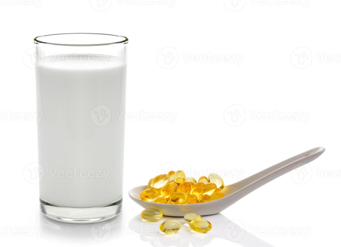 glass of milk mint and fish oil  isolated on white background photo