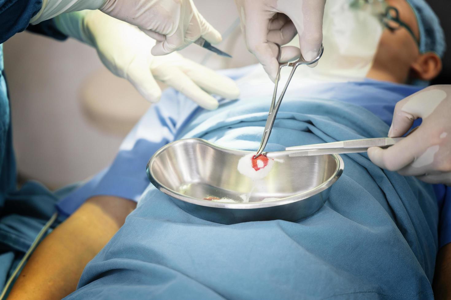 surgeon operating patient with an assistant in the operating room. Surgery and emergency concept photo