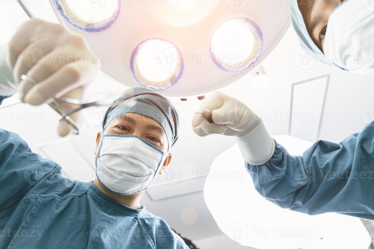 surgeon operating patient with an assistant in the operating room. Surgery and emergency concept photo