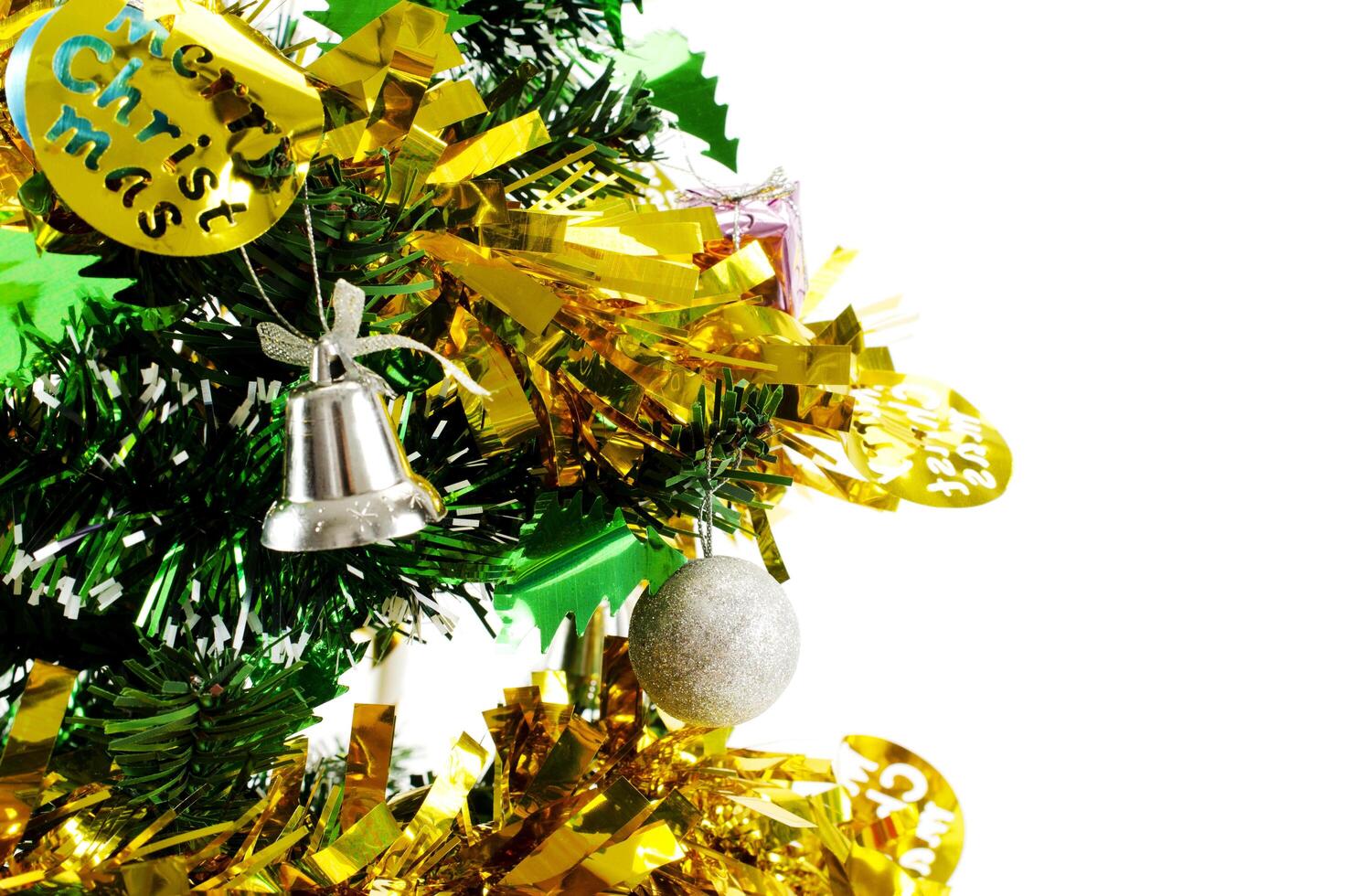 Close up of bell and ball christmas tree decoration on white backgrounds photo