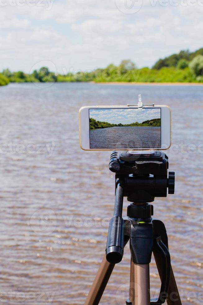 Using smartphone like professional photo camera on tripod