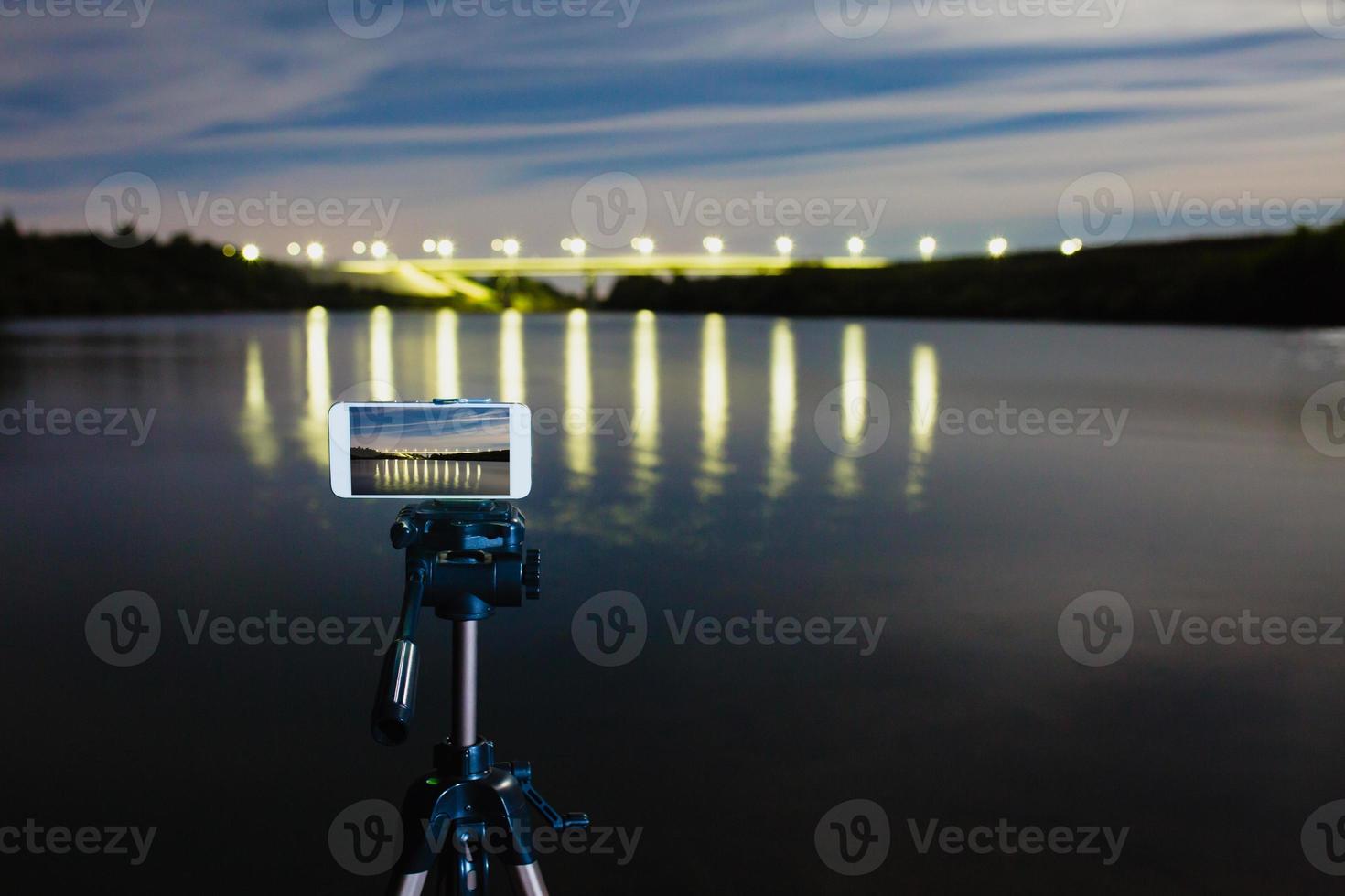 Using smartphone like professional camera on tripod to capturing night landscape photo