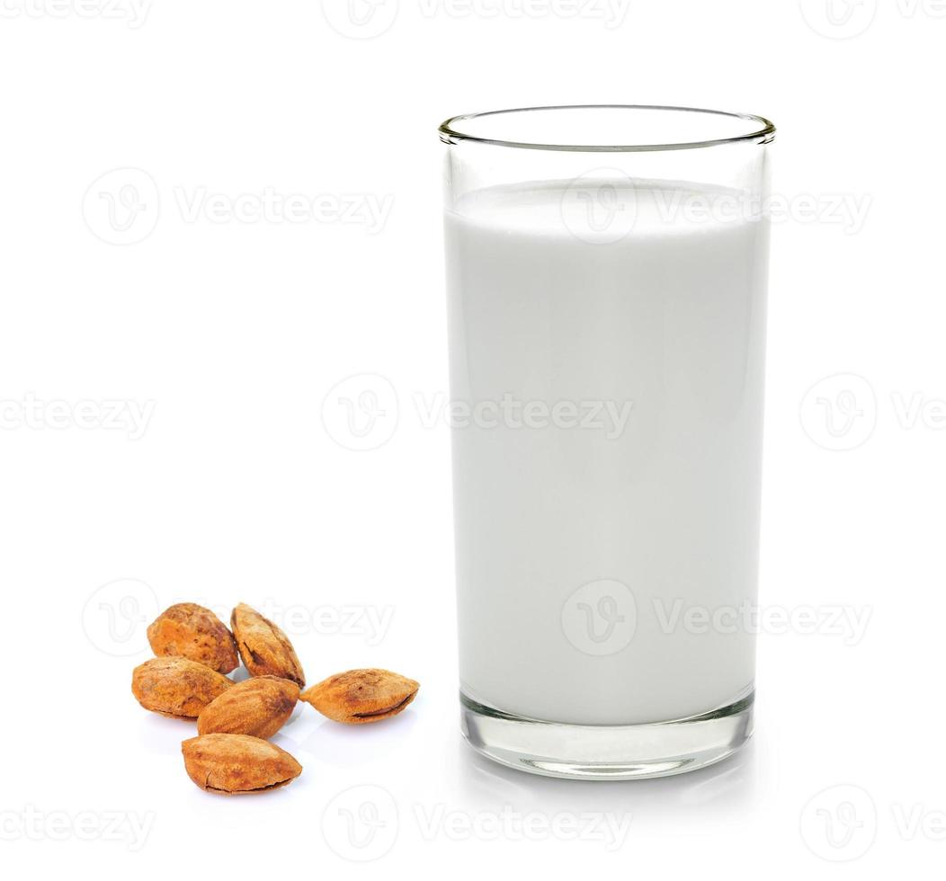 glass of milk and almond isolated on white background photo