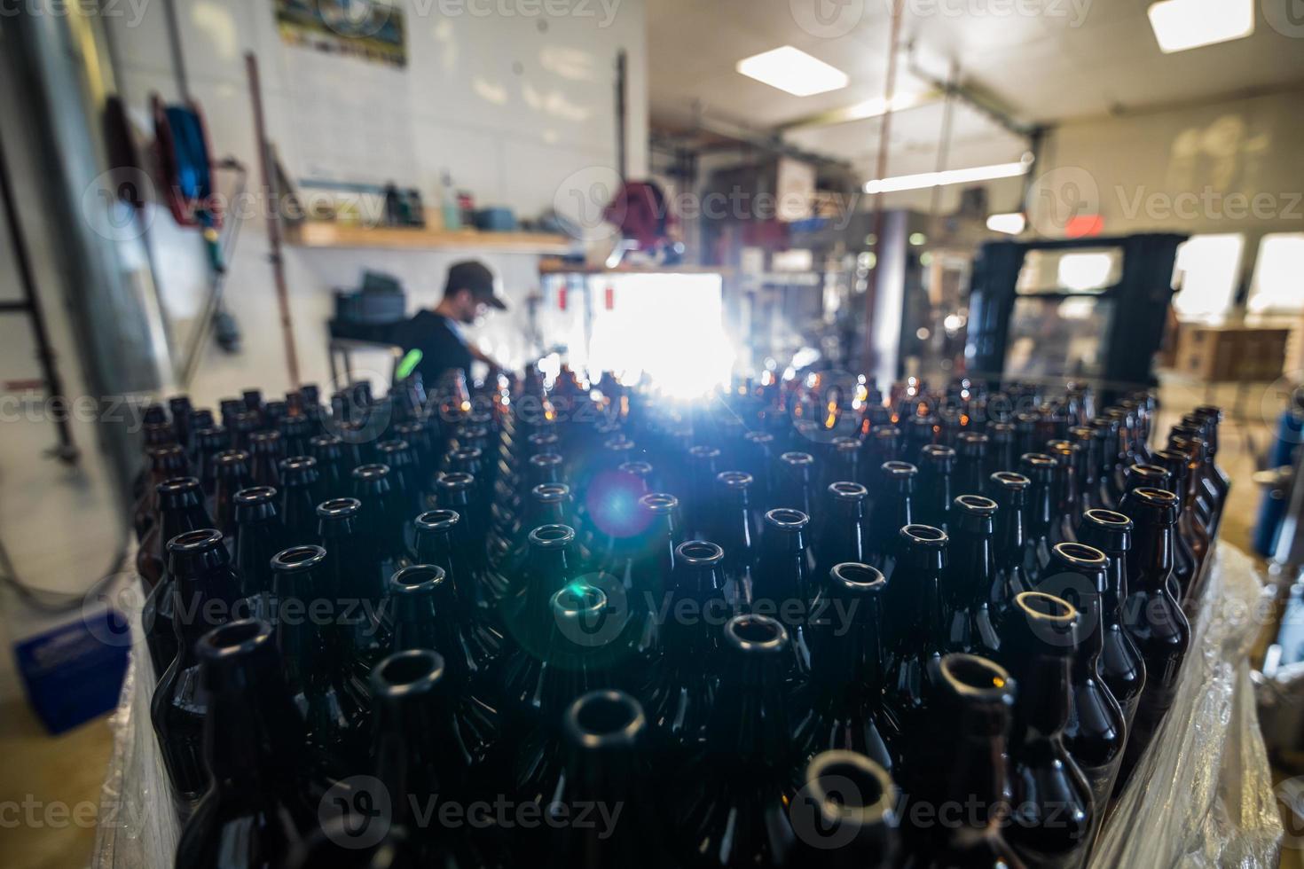 Glass bottles stacked for filling photo