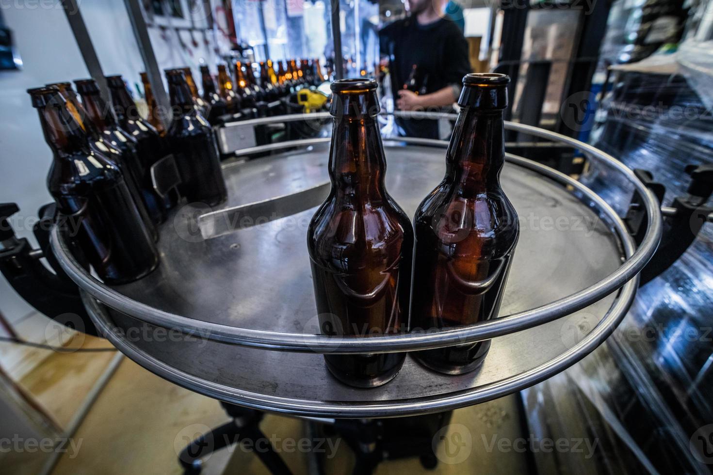 Line and bottles on microbrewery photo