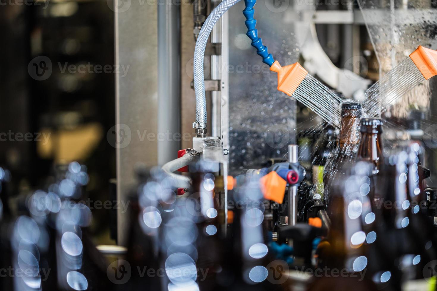 Bottles washing after filling photo