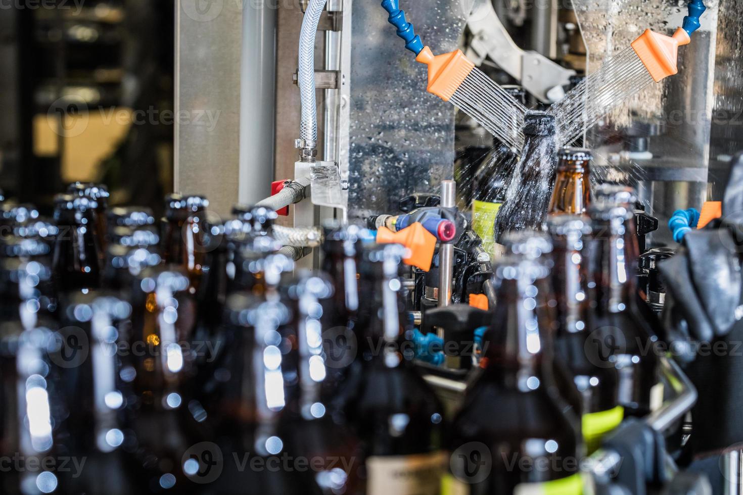 Bottles washing on conveyor photo