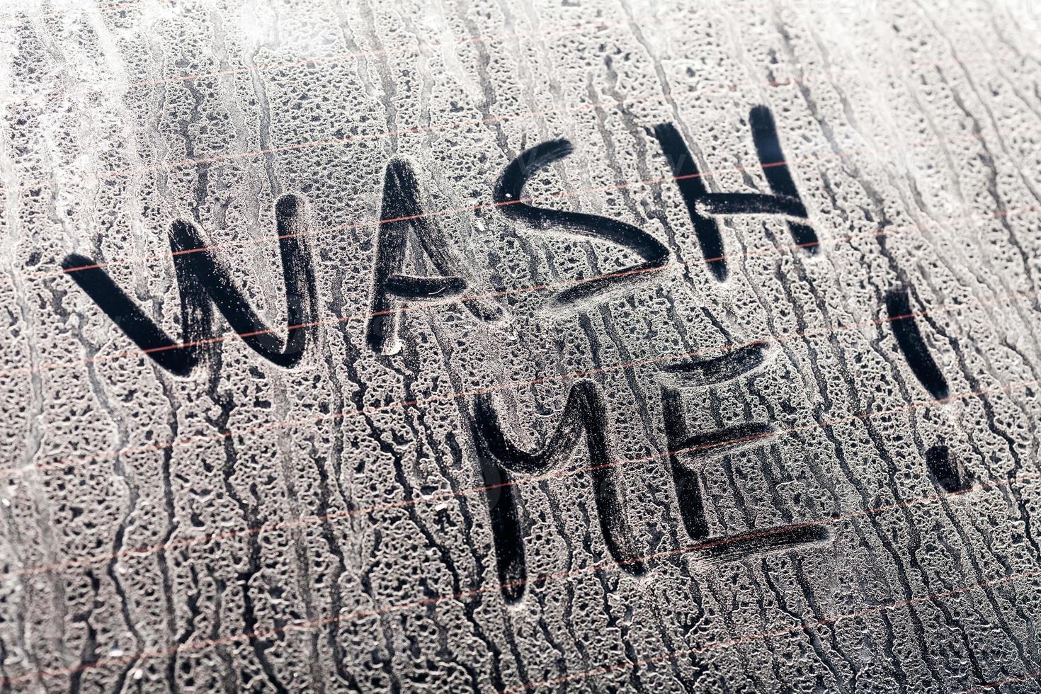 Wash Me Words on a Dirty Car Window photo