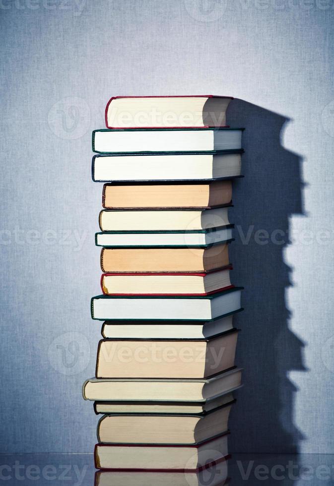 Very high stack of books photo