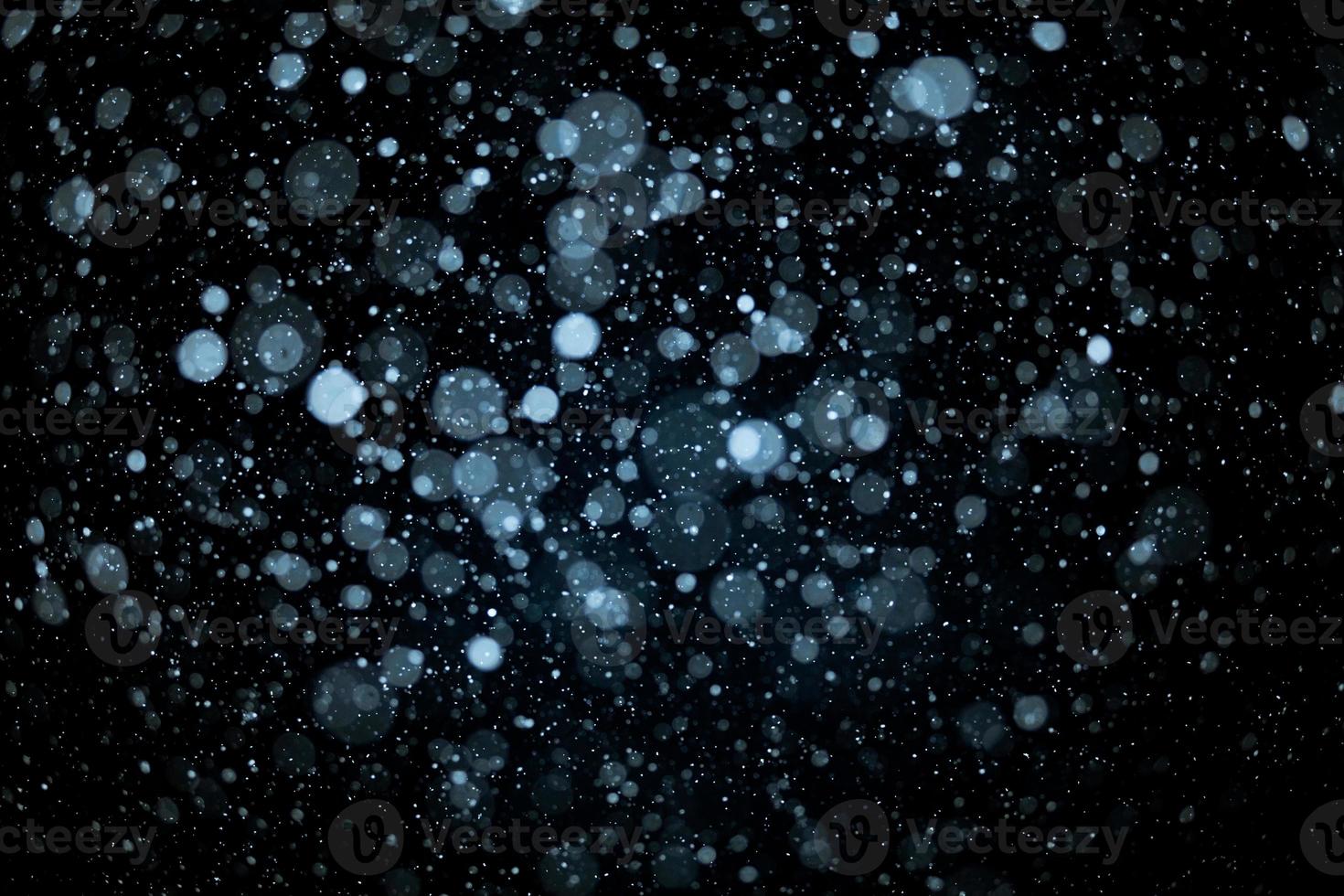 Snowstorm texture at night photo