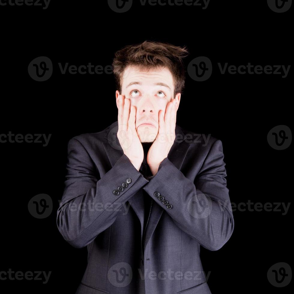 Despair businessman over black background photo