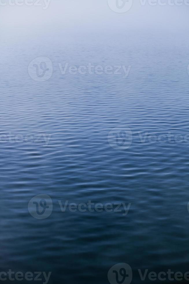 Calm Water texture on a Foggy Morning photo