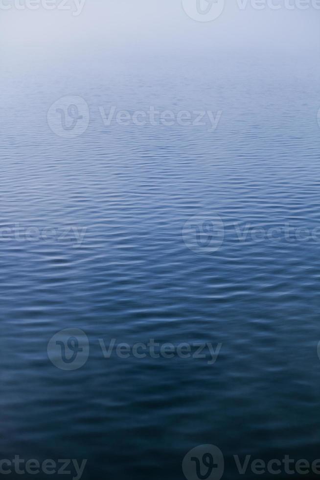 Calm Water texture on a Foggy Morning photo