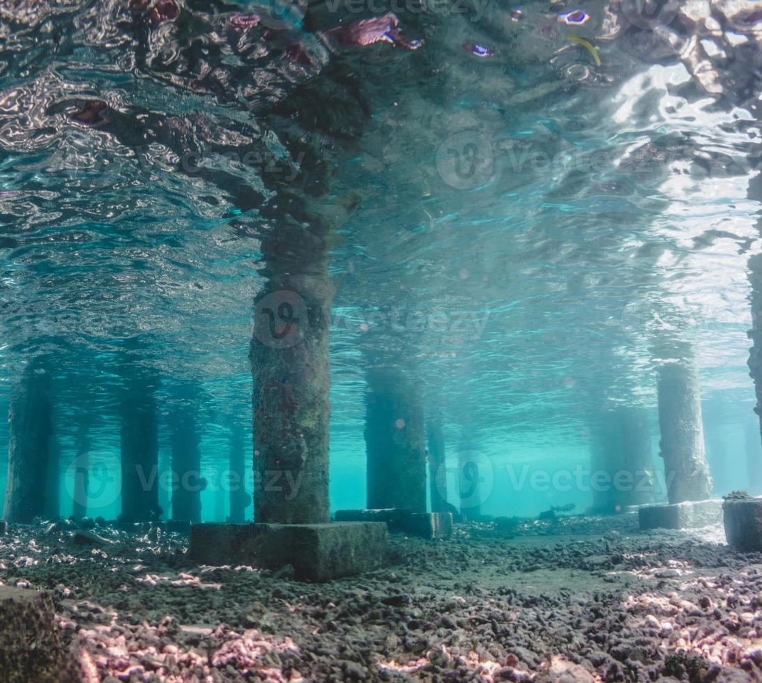 Underwater view of Under a Pier with Pillars and Sun Light photo