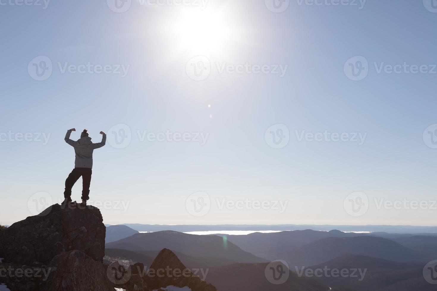 Victorious Woman Enjoying the Success of the Richardson Mountain's Summit photo