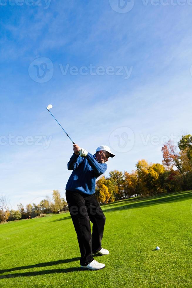 Man playing golf photo