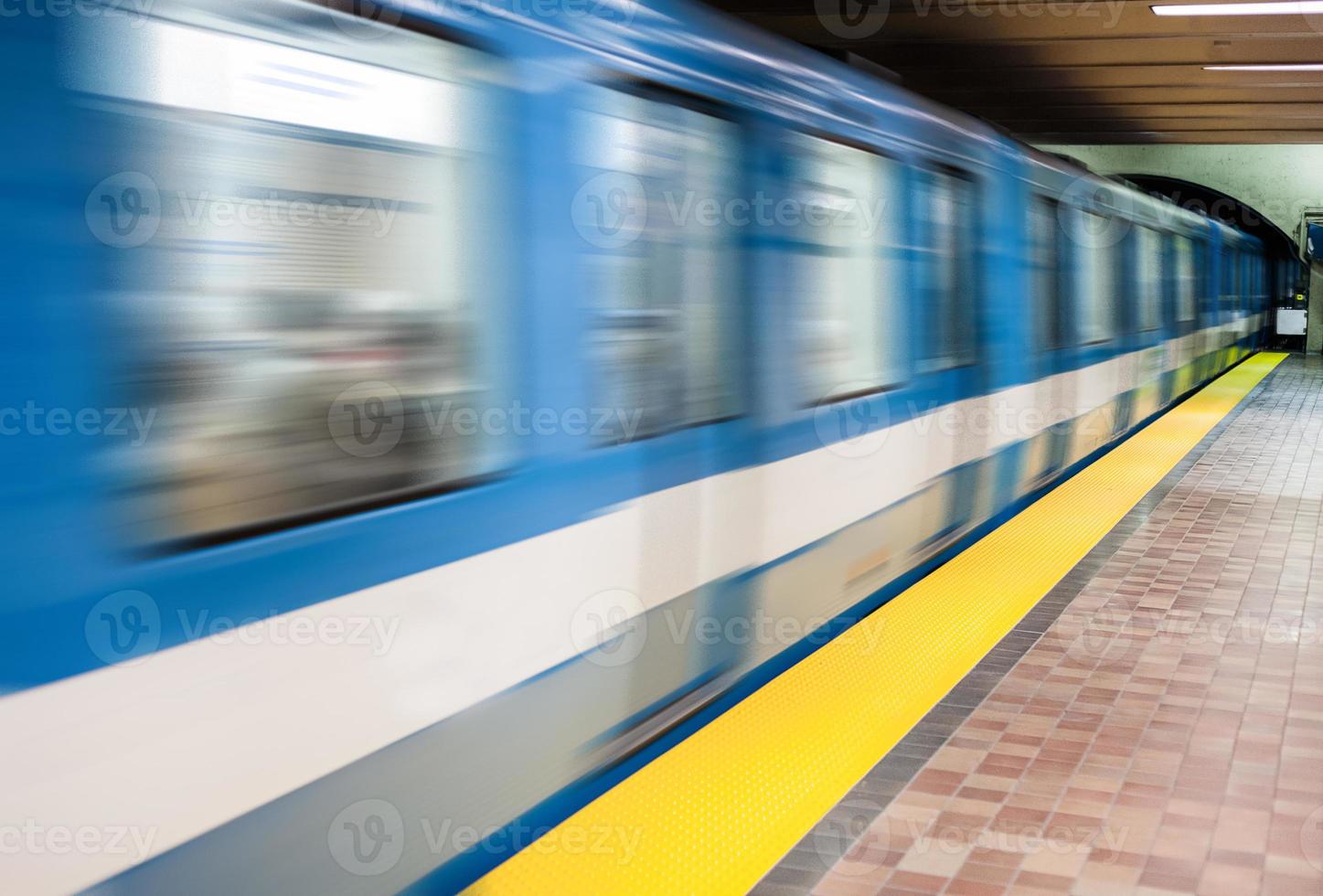 Moving subway train and Motion blur with an empty subway platform. photo