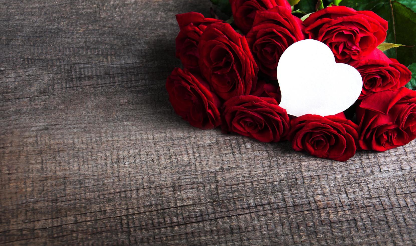 Red roses on a table photo