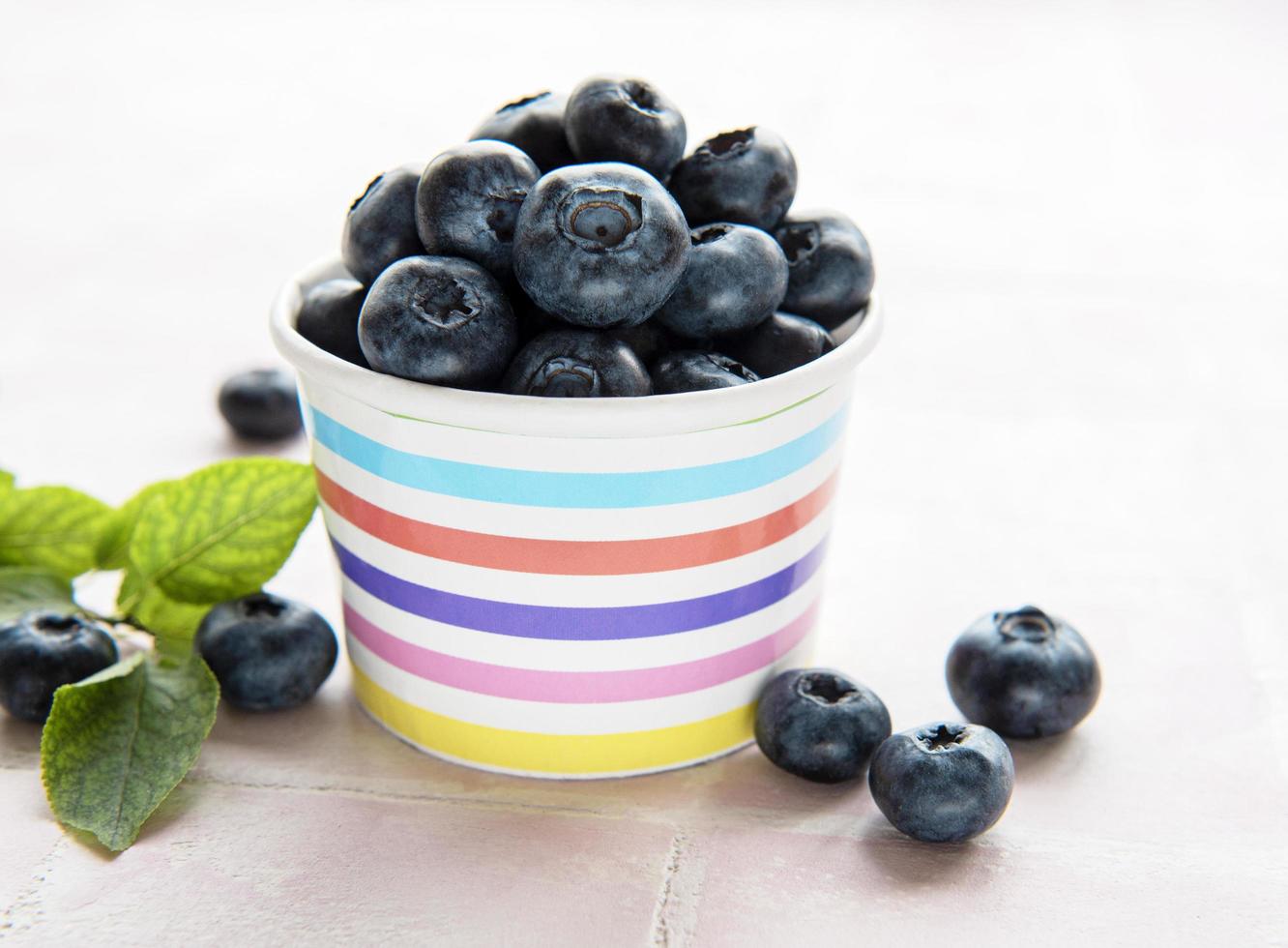 Blueberries on tile background photo