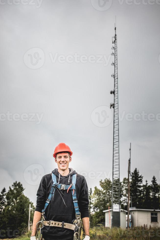 Telecom Technician man in uniform with harness photo