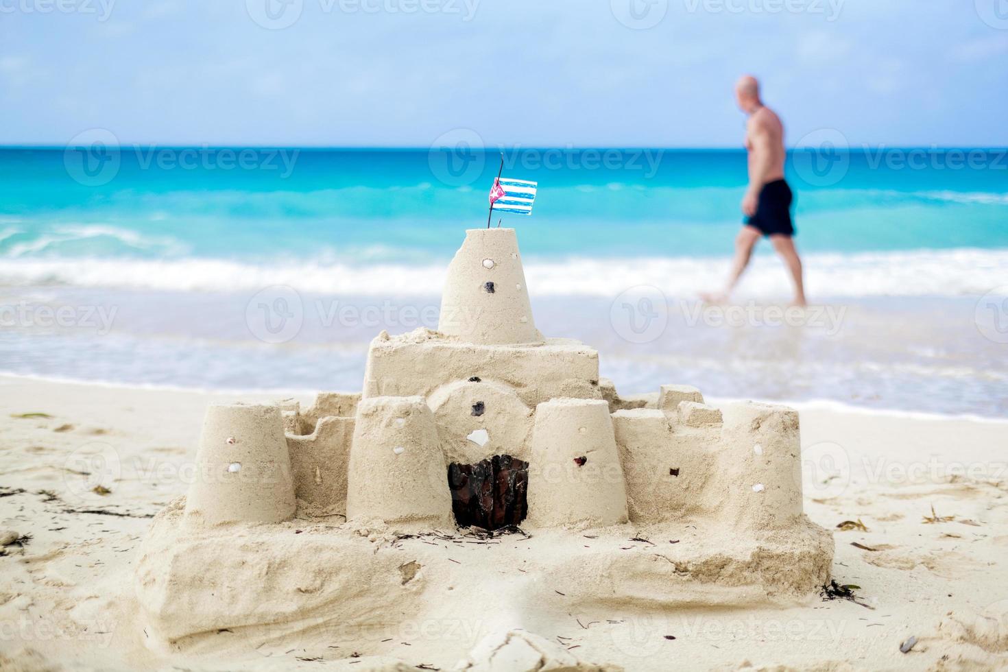 Cuban Sandcastle with the country Flag in Cuba. photo