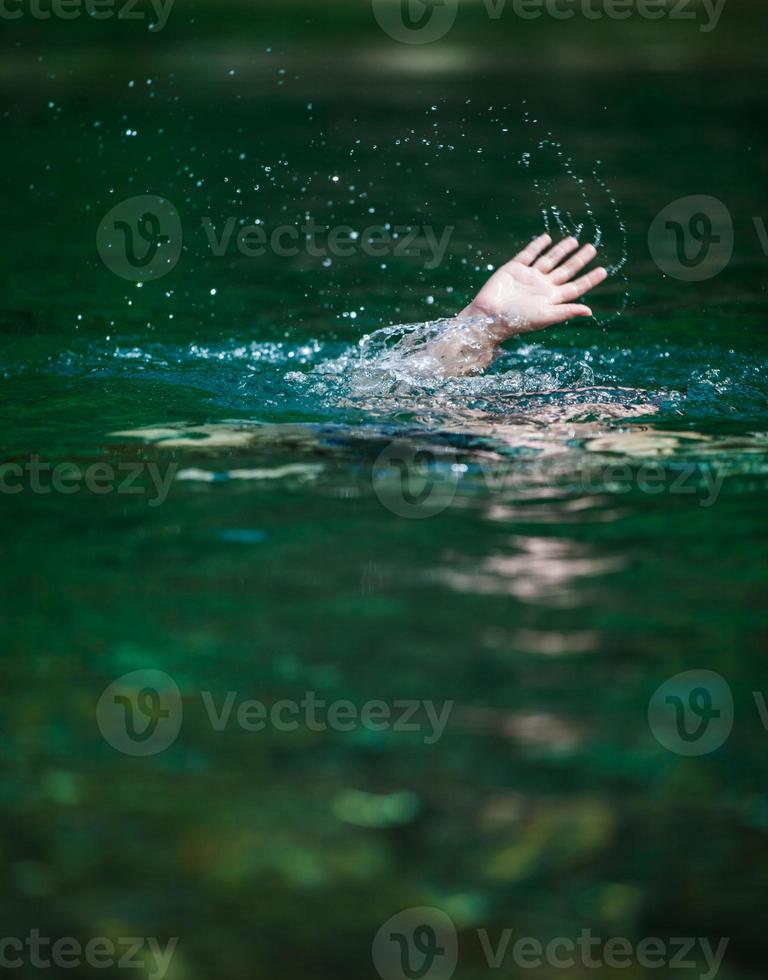 Hand of Someone Drowning and in Need of Help photo