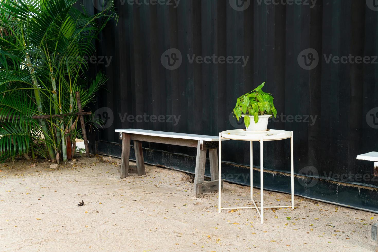 bench with black wall background photo