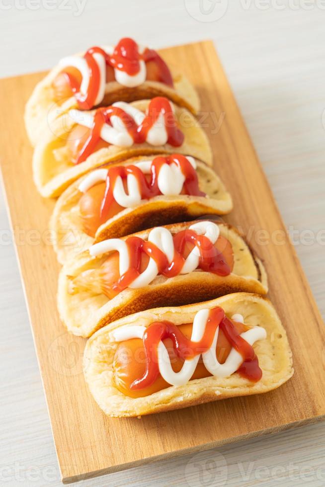 flat pancake roll with sausage photo