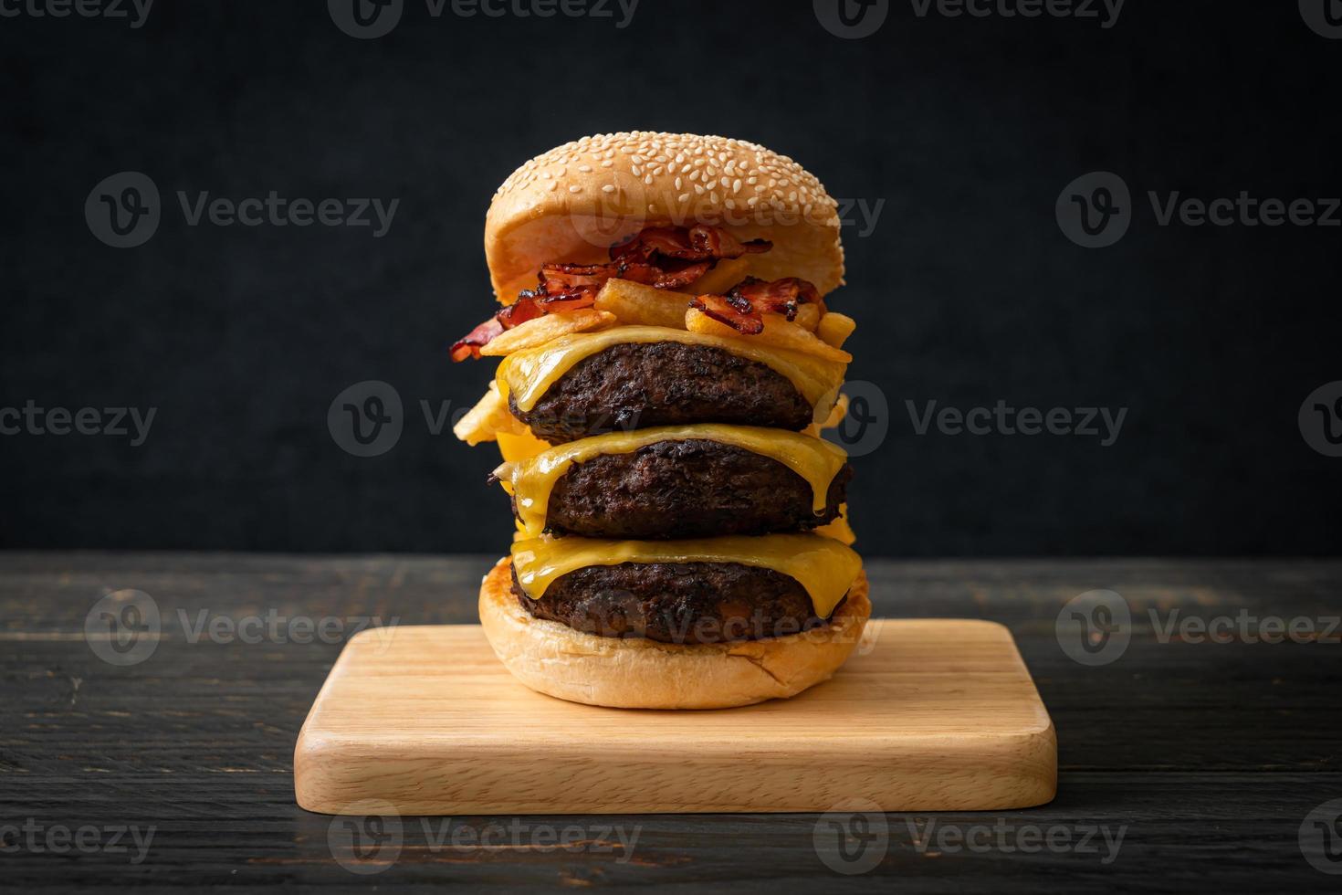 hamburger or beef burgers with cheese, bacon and french fries photo