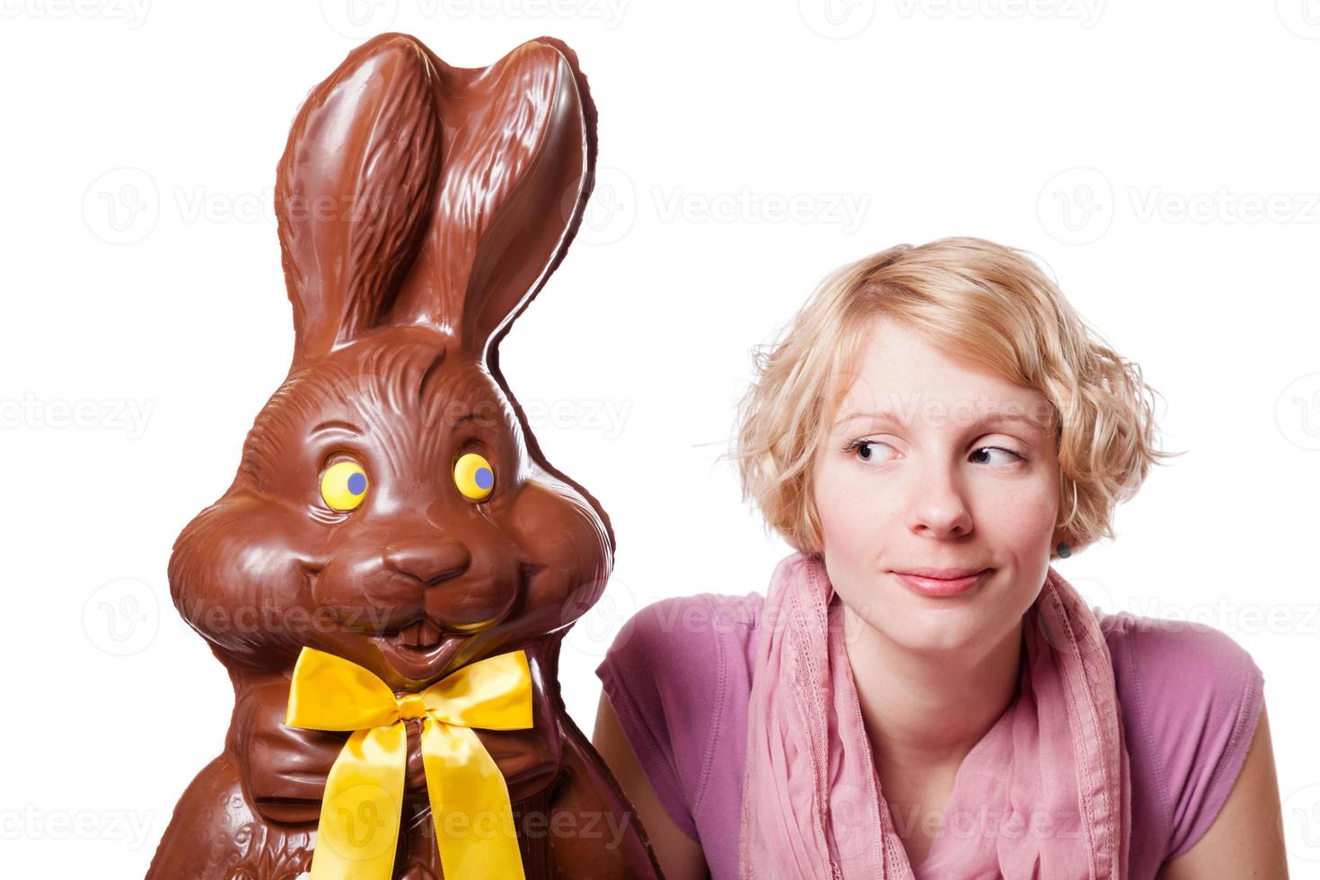 Chocolate Easter Bunny Looking at a Blond Girl photo