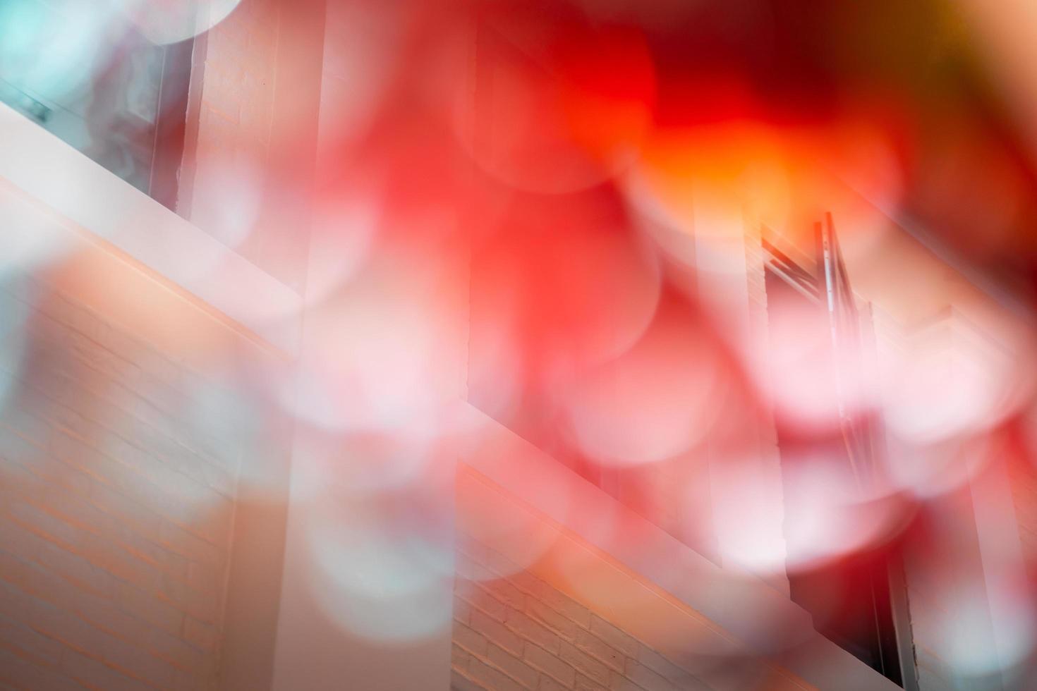 Blurred background of red leaves during autumn, open window background. photo