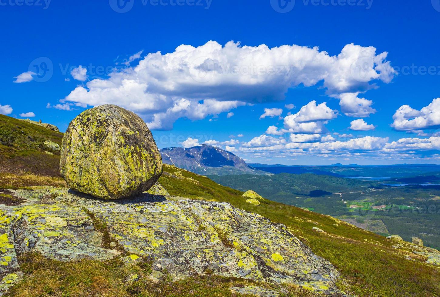 Huge rock big boulder snowed in Mountains panorama Norway Hemsedal. photo