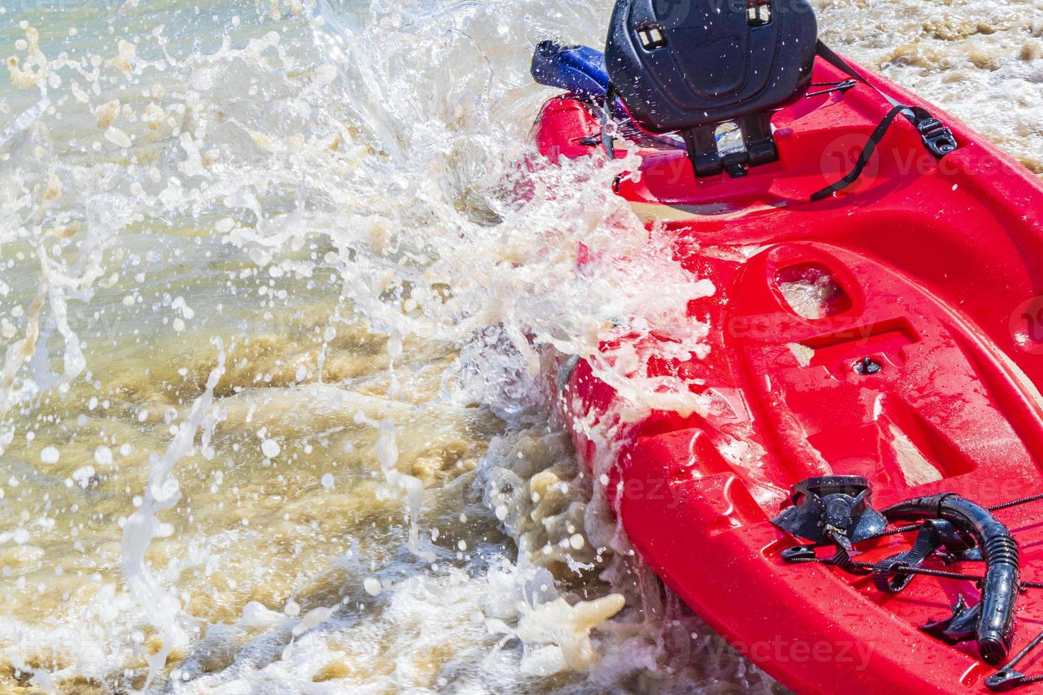 Red canoes at tropical beach panorama Playa del Carmen Mexico. photo