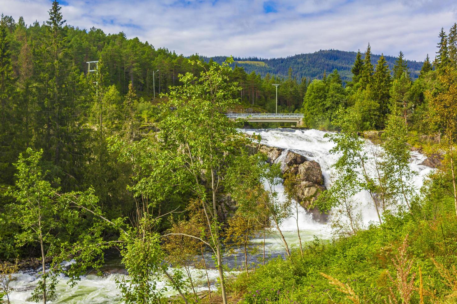 Beautiful waterfall and bridge landscape of Norway. photo