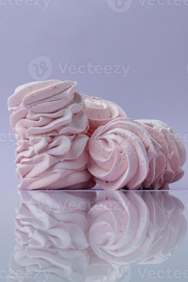 pink homemade marshmallows on purple background photo