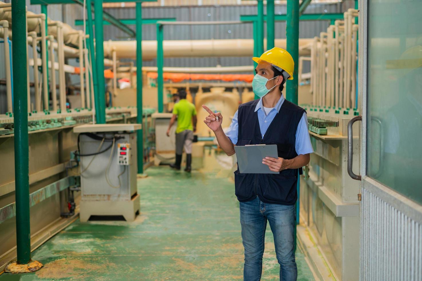 Engineers monitor the operation of industrial machinery and control systems. photo