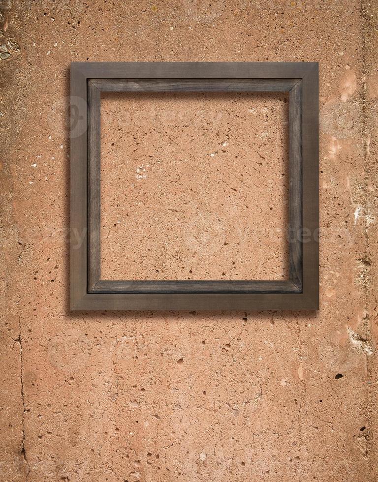 Concrete texture and wooden frame photo