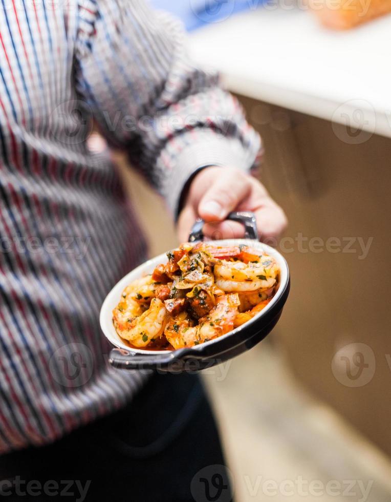 Man Presenting a Typical Tradional Portugese Meal photo