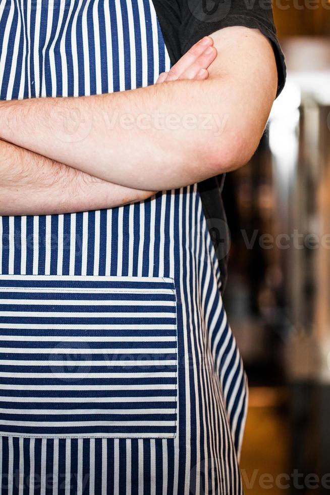 Cook Closeup in the Kitchen with Crossed arms photo