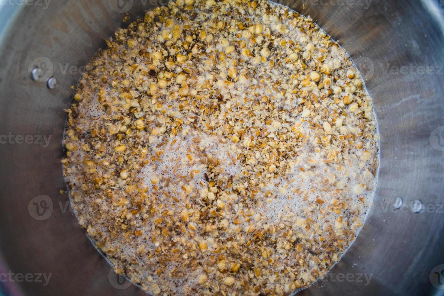 Mashing in a Stainless Kettle a Home Brew Cream Ale  with Crushed Barley and Corn photo