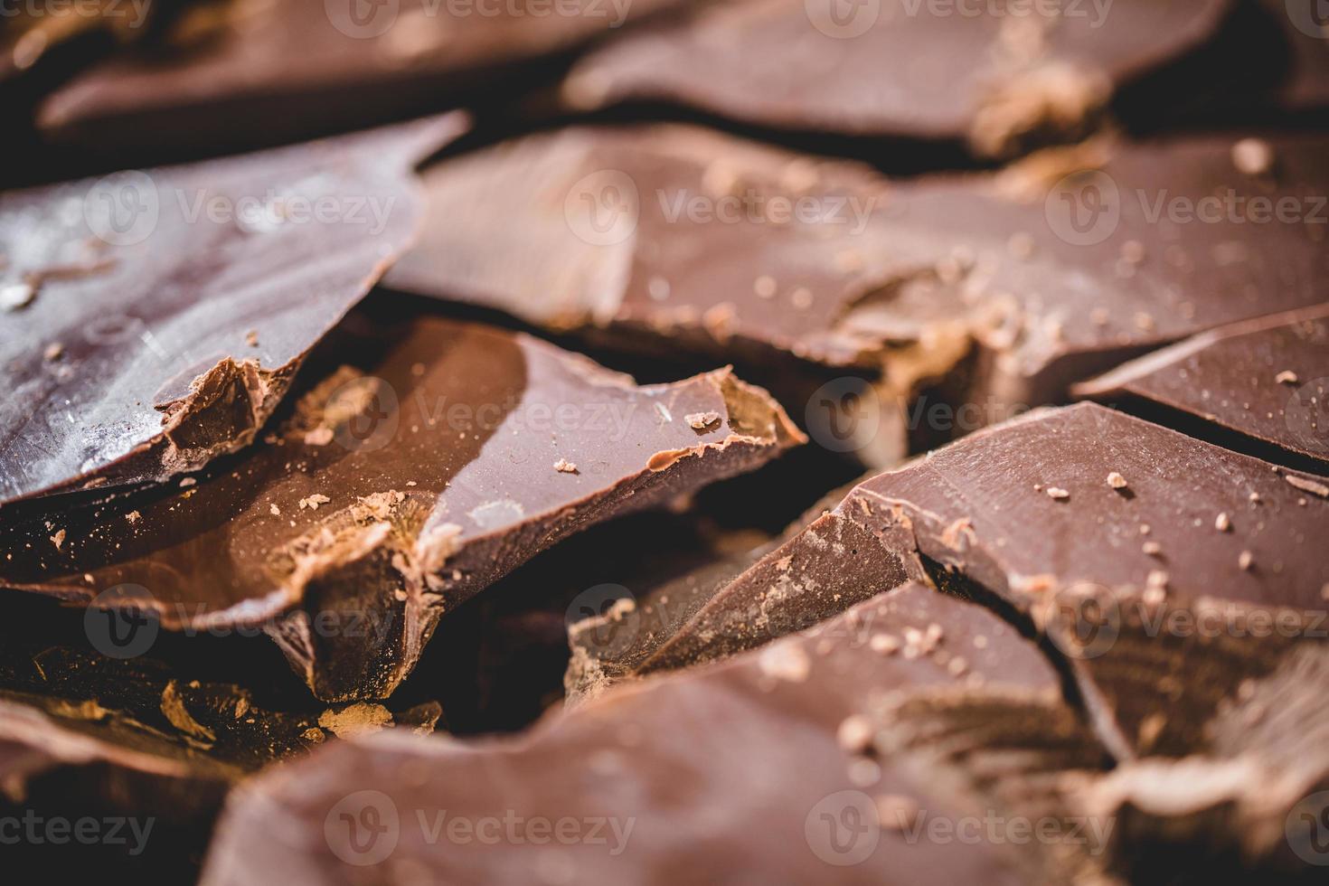 Big block of chocolate broken into chunks photo