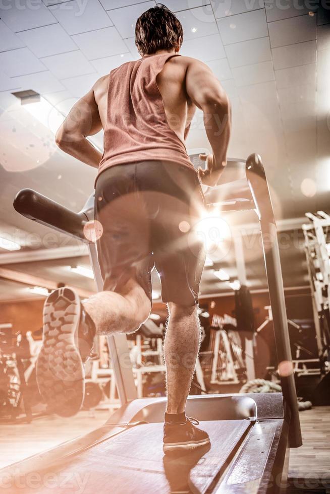 Man running on treadmill photo