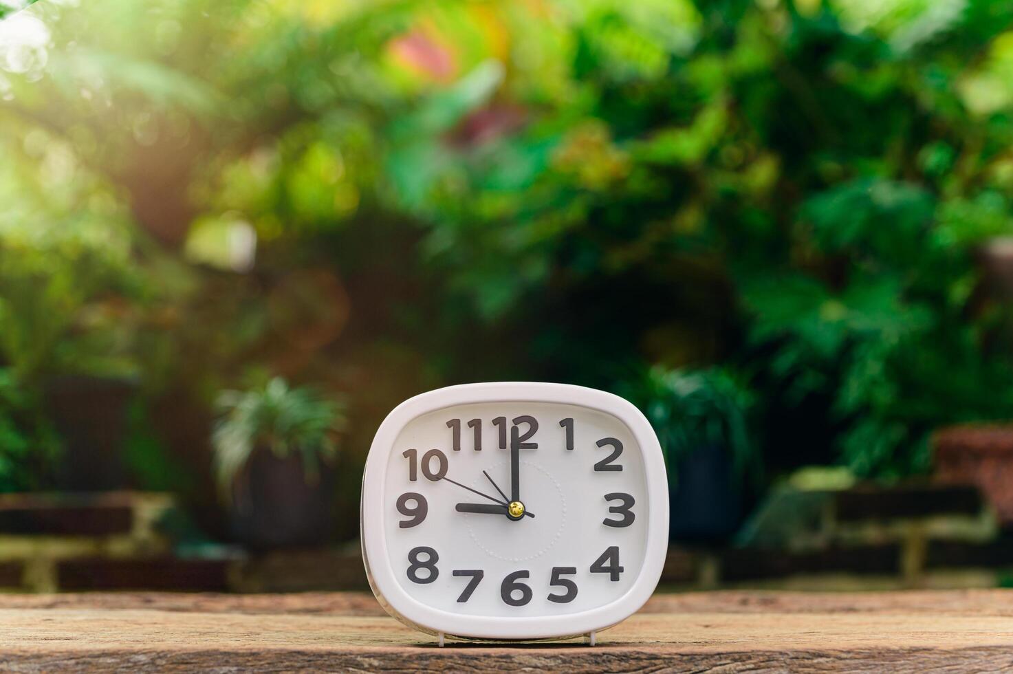 clock is placed on the table showing the time of life. 4339377 Stock Photo at Vecteezy