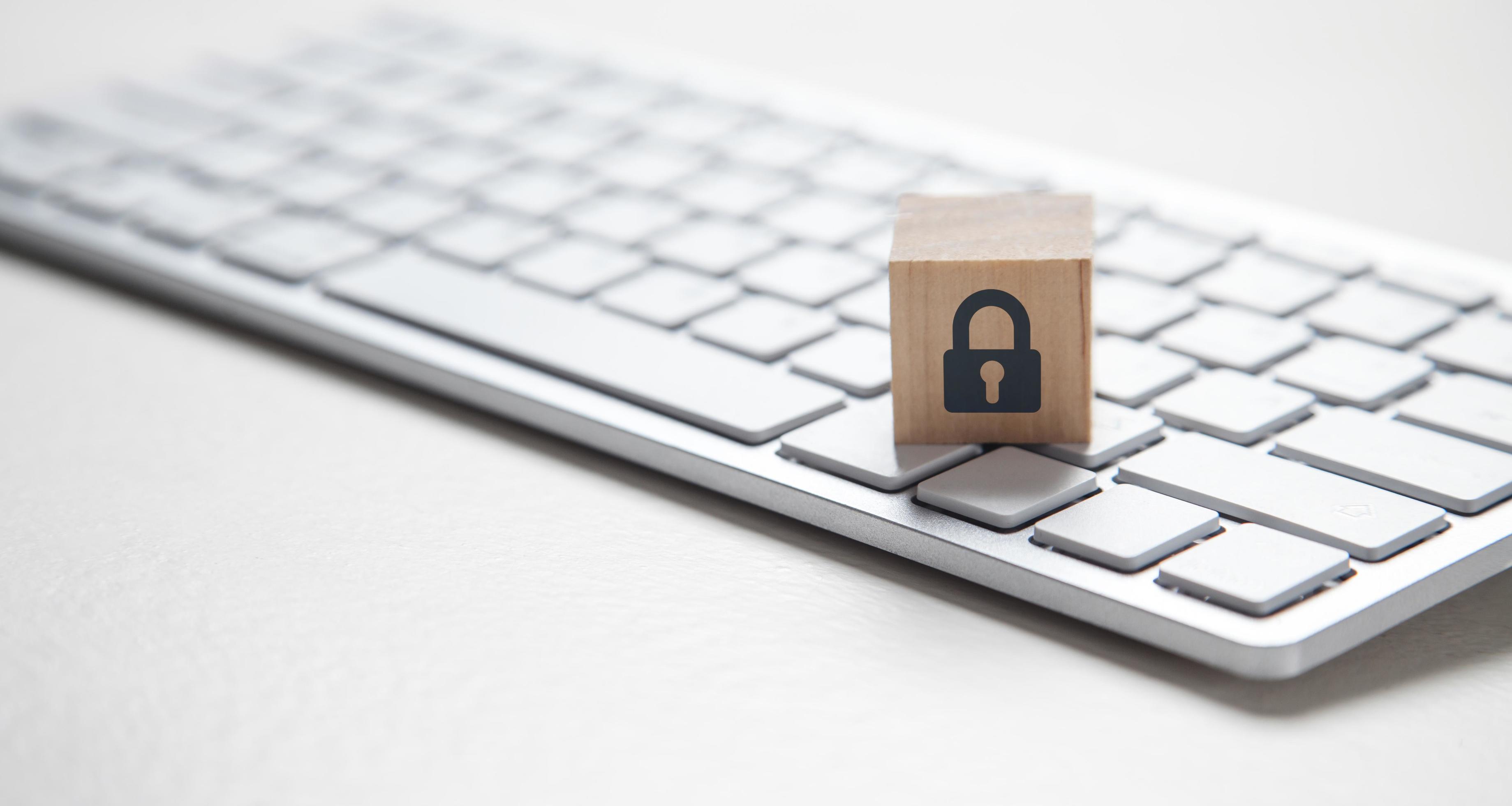 Padlock symbol on wooden block. Computer keyboard 4340191 Stock Photo