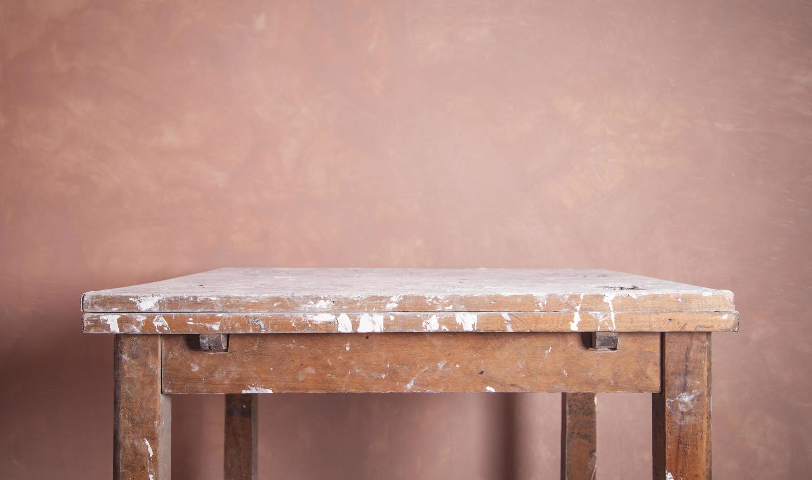 Old table. Room before renovation. Wall background photo